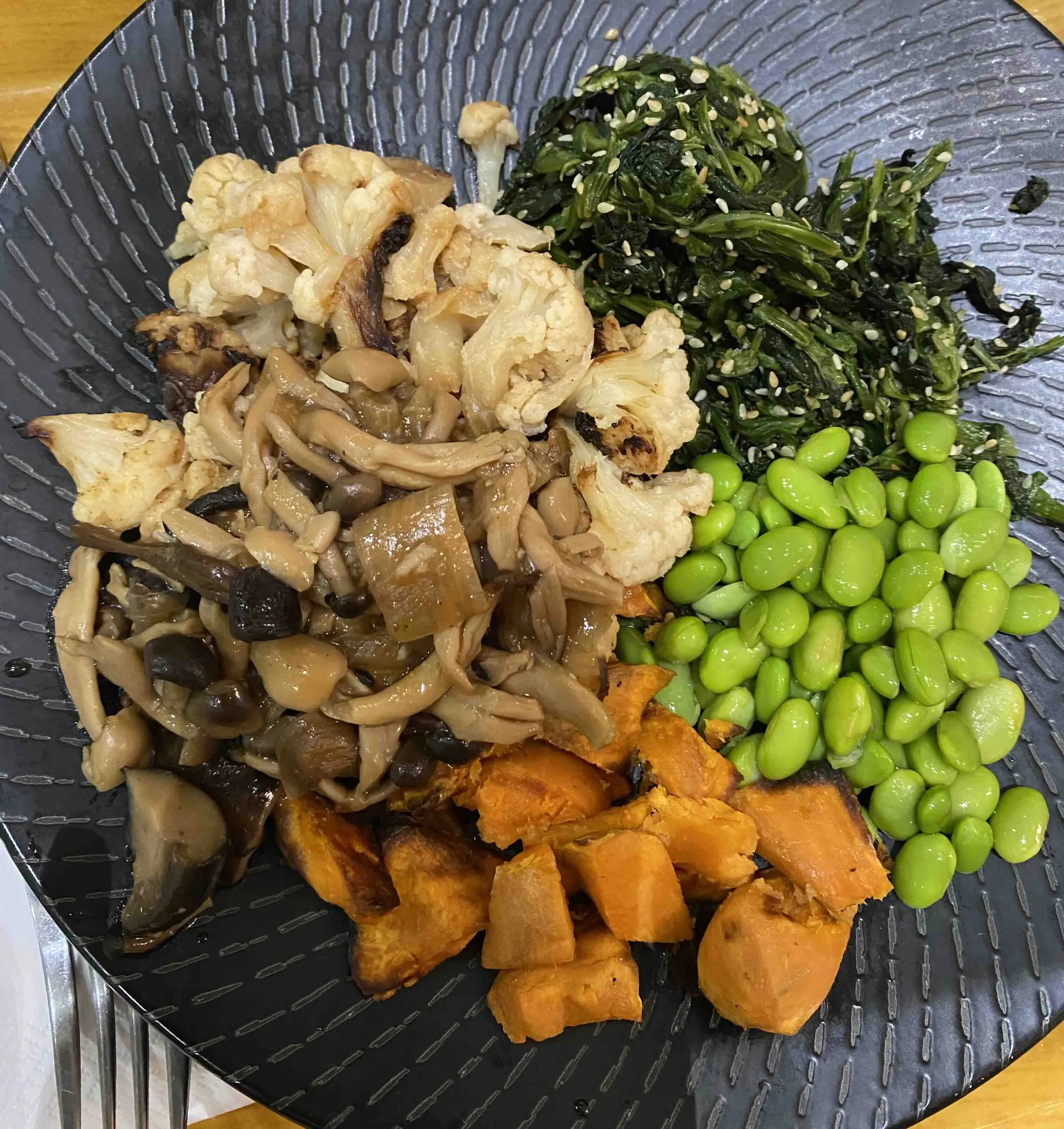 Enoki mushrooms, seaweed, sweet potato, roasted cauliflower, and edamame beans