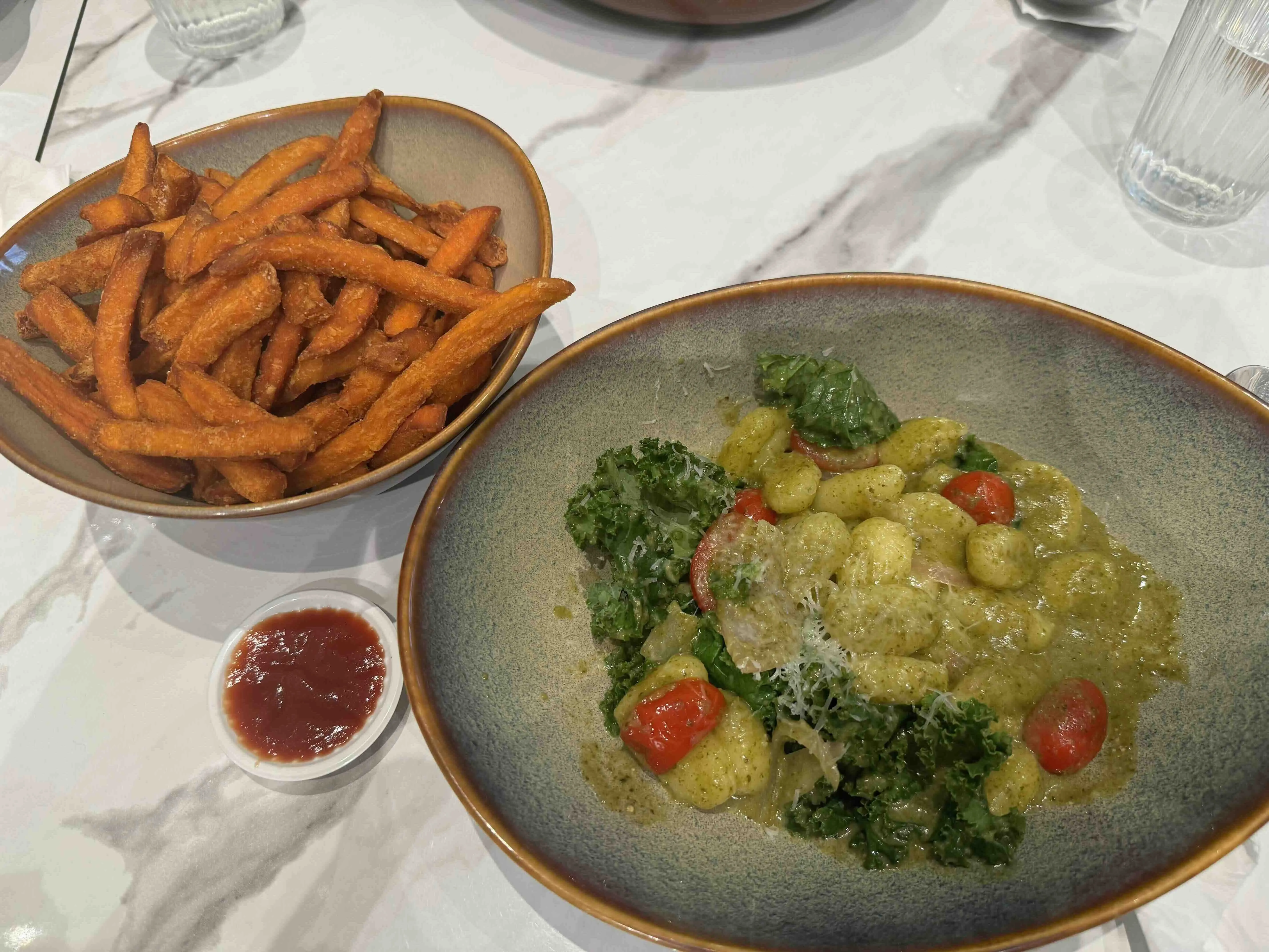 Pesto&nbsp;Gnocchi and sweet potato fries at Miligram:&nbsp;https://www.cafemilligram.com.au/stores/marina-one-singapore/